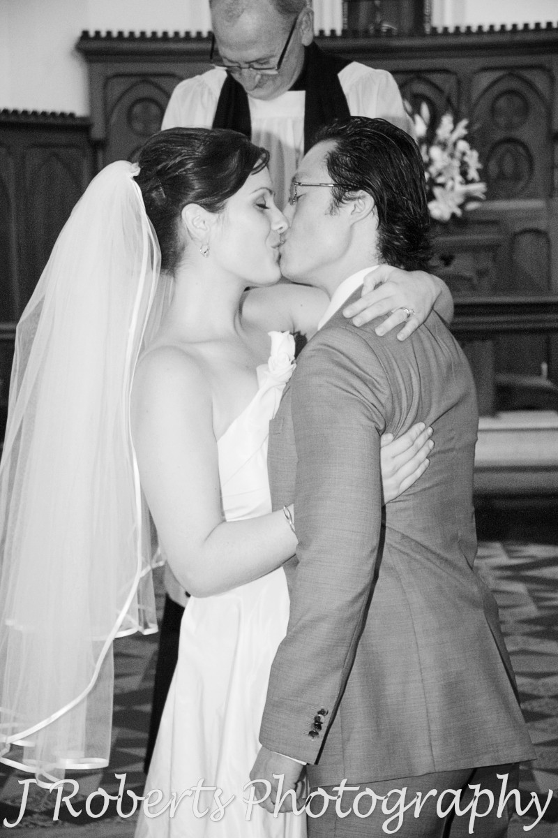 Bride and groom first Kiss - wedding photography sydney